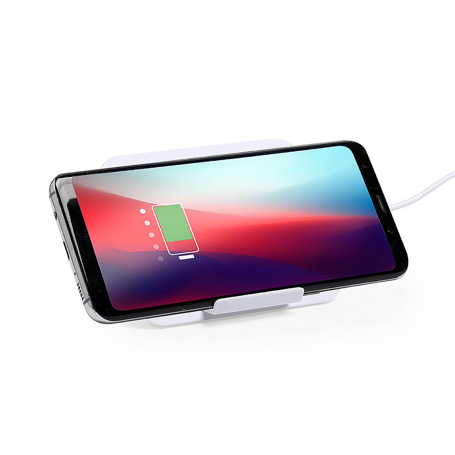 Uno smartphone si sta caricando su un supporto di ricarica wireless bianco.