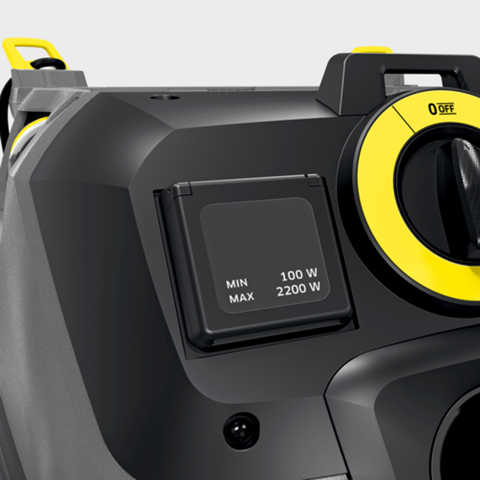 Czarna myjka wysokociśnieniowa z żółtymi akcentami, gniazdem i przełącznikiem obrotowym.