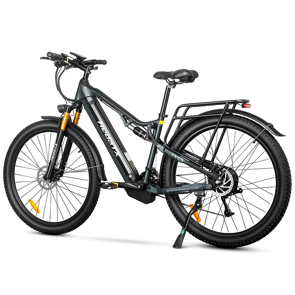 Dunkelgraues E-Bike mit Federung, Gepäckträger und Scheibenbremsen.