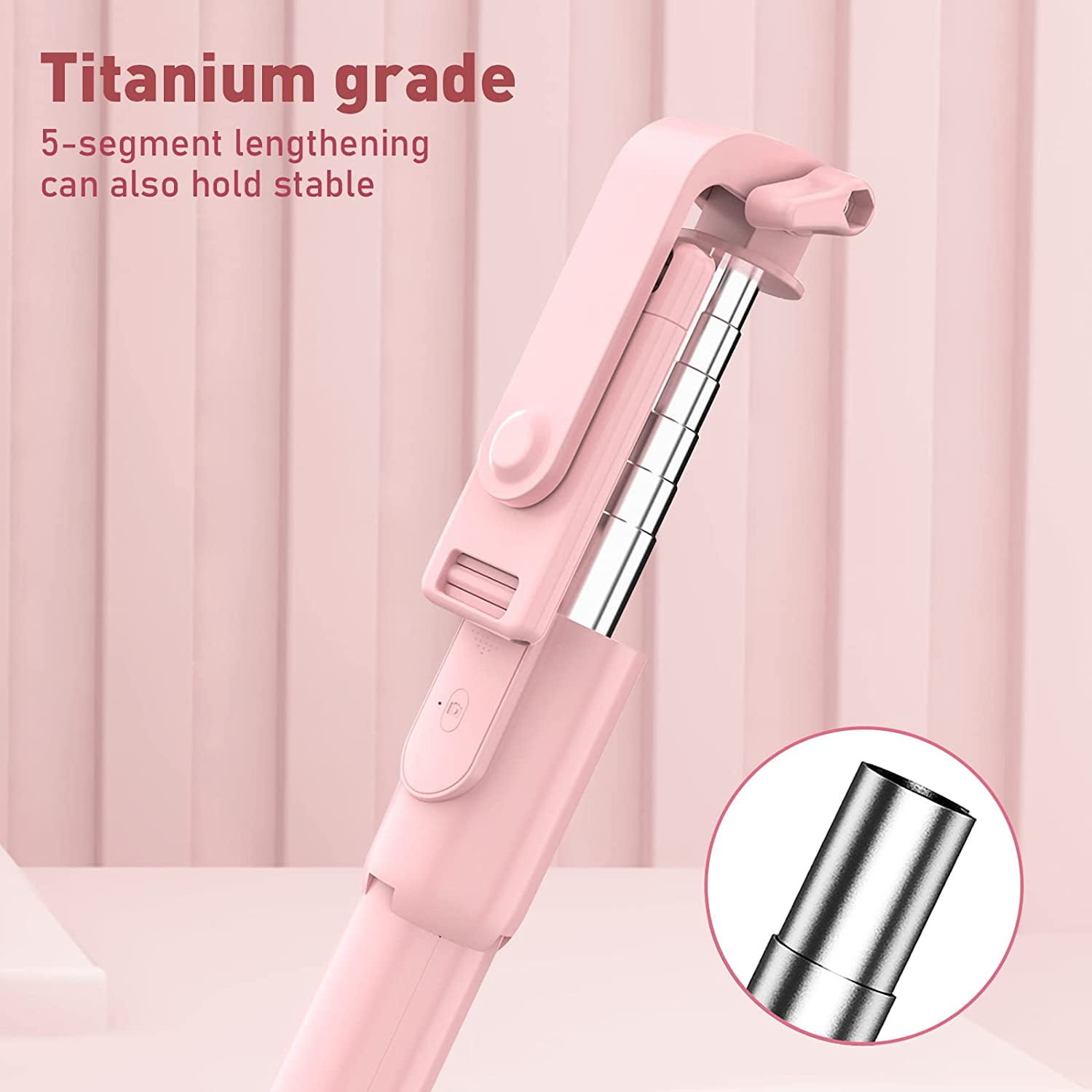 Ein pinker Selfie-Stick mit ausziehbarem Metallrohr und Text.