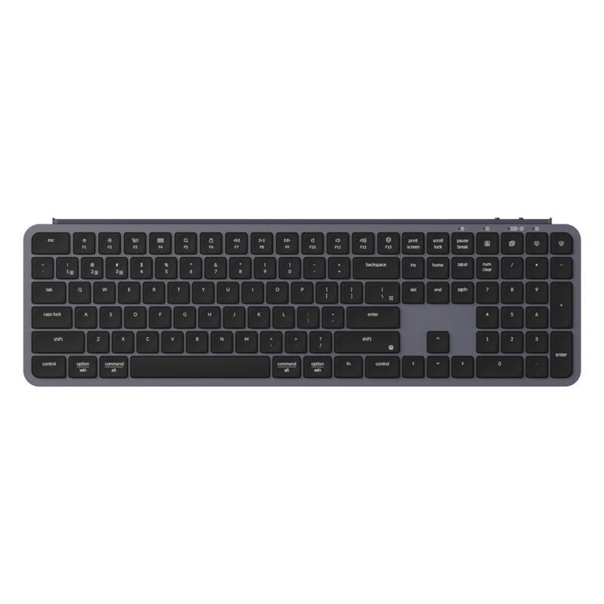 Un clavier sombre avec des touches argentées et des inscriptions blanches.