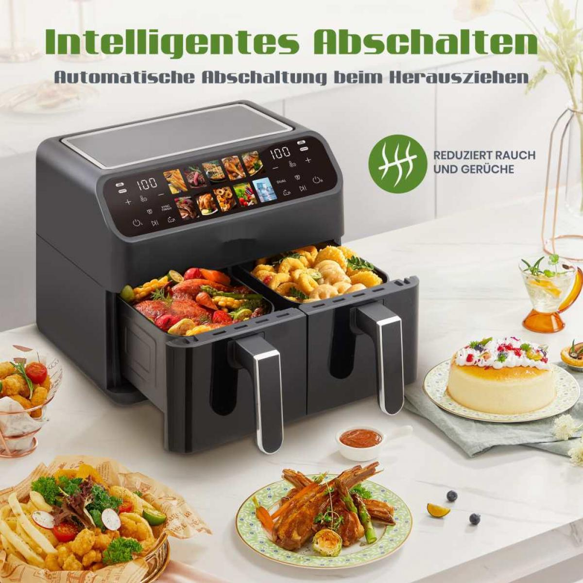 Doppel-Heißluftfritteuse mit zwei Körben, gefüllt mit verschiedenen Speisen. Daneben sind ein Kuchen und Fleischgerichte angerichtet.