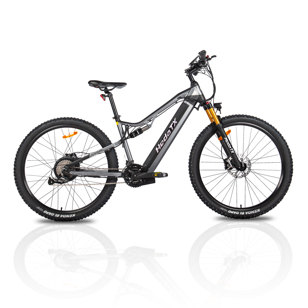 Szary rower elektryczny typu mountain bike z amortyzacją i szerokimi oponami.