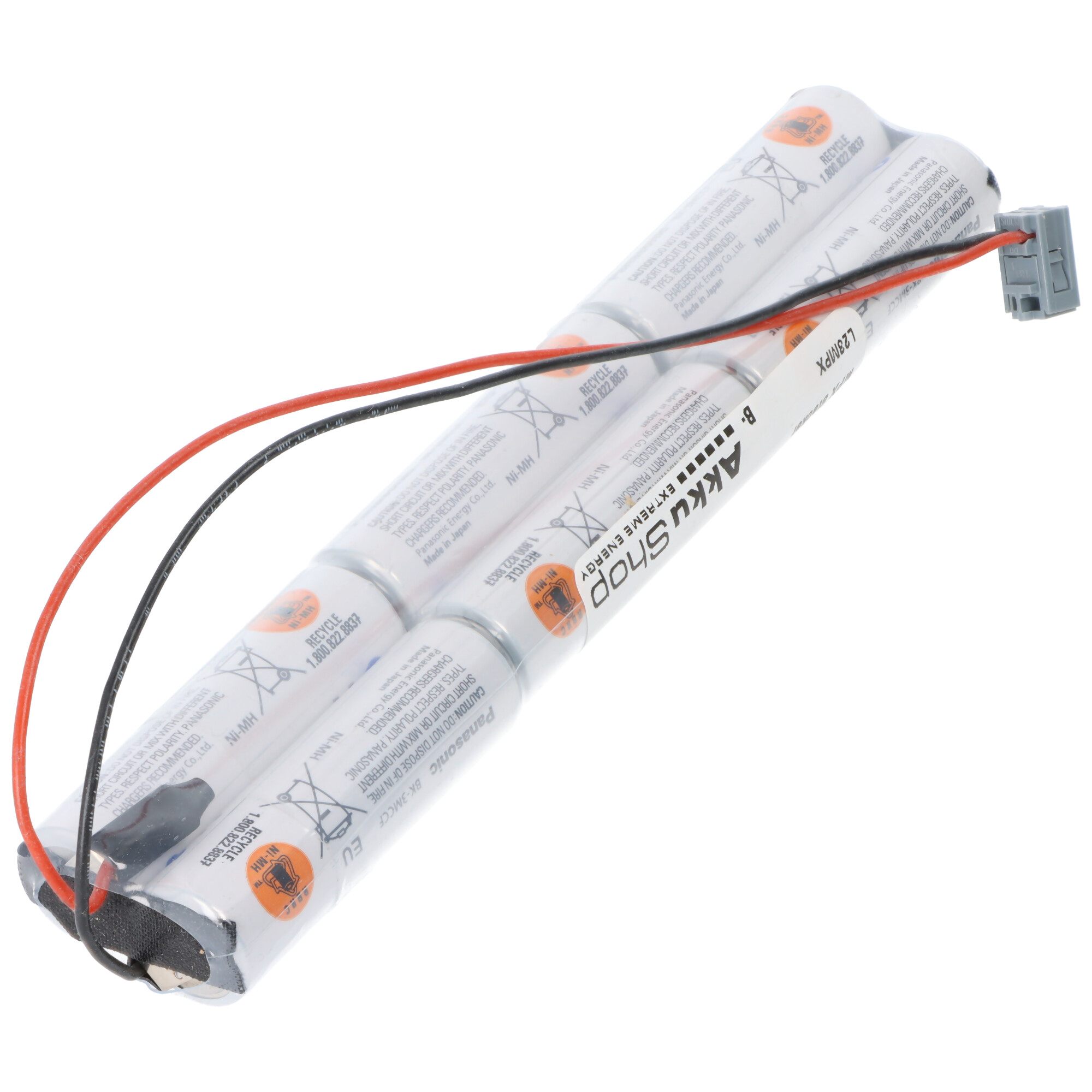 Ein Akkupack mit vier Ni-MH-Zellen mit roten und schwarzen Kabeln und einem grauen Stecker.