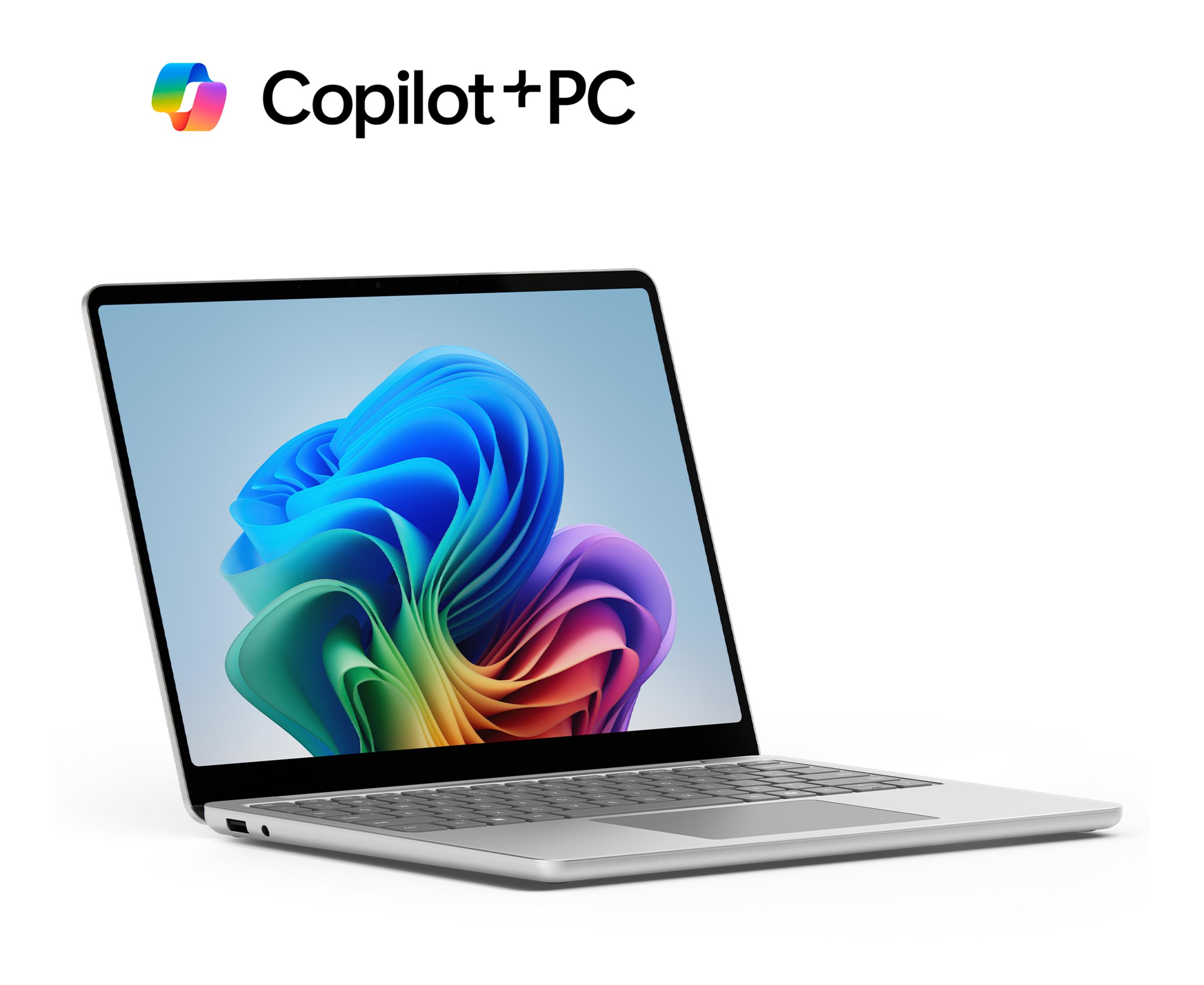 Ein silberner Laptop mit buntem Hintergrund auf dem Bildschirm.