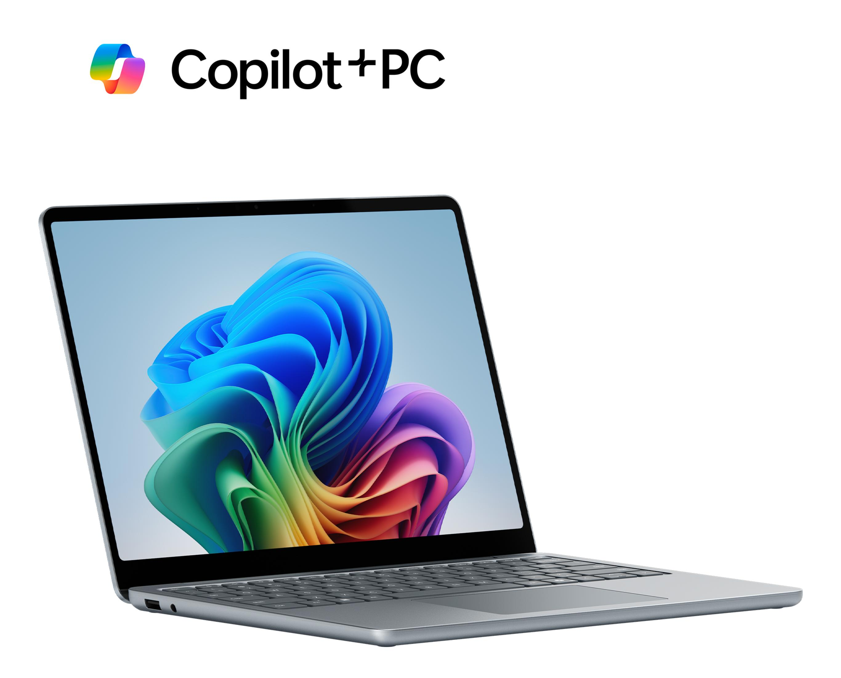 Ein graues Copilot+PC-Laptop mit buntem Hintergrundbild.