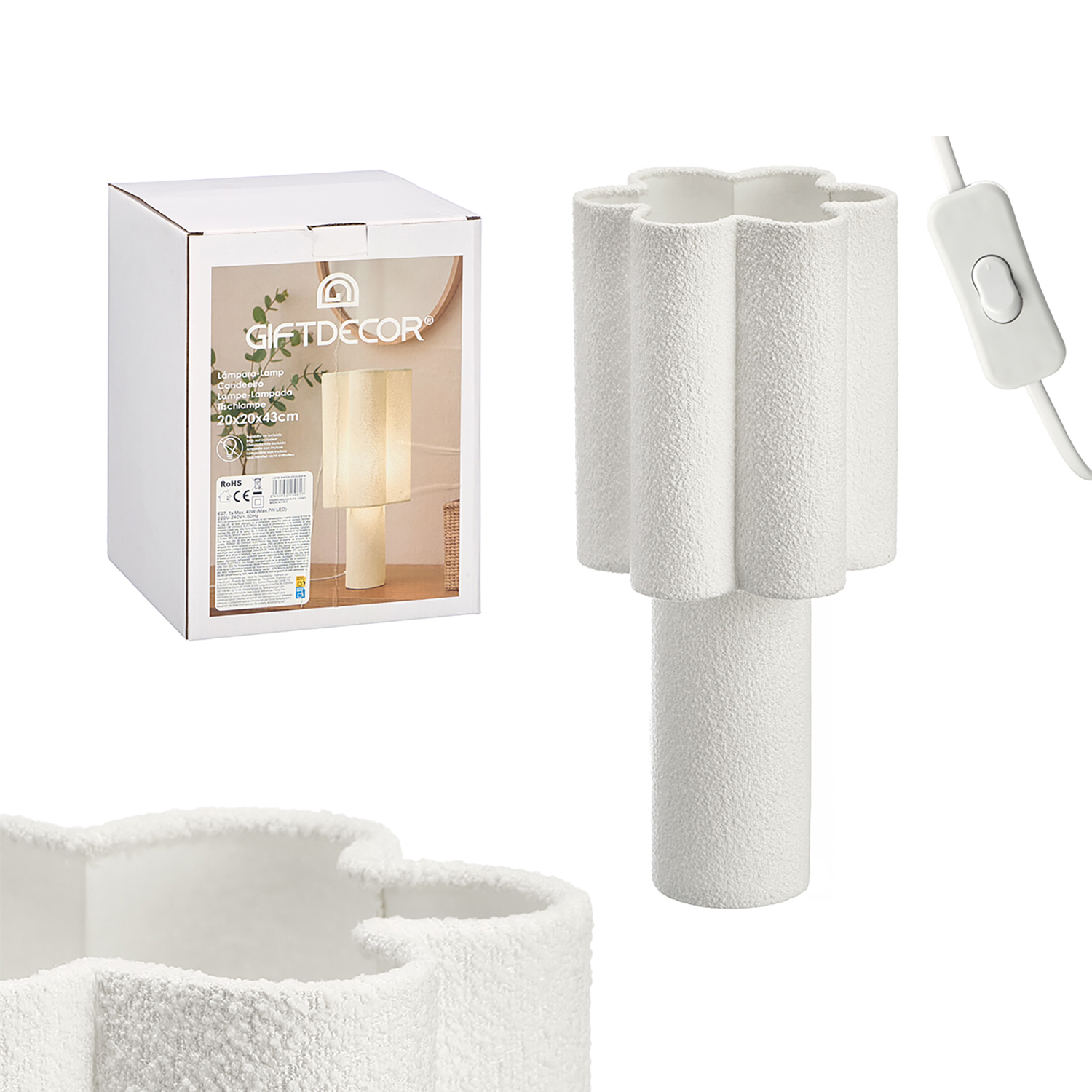 Lámpara de mesa blanca con forma de flor y interruptor.