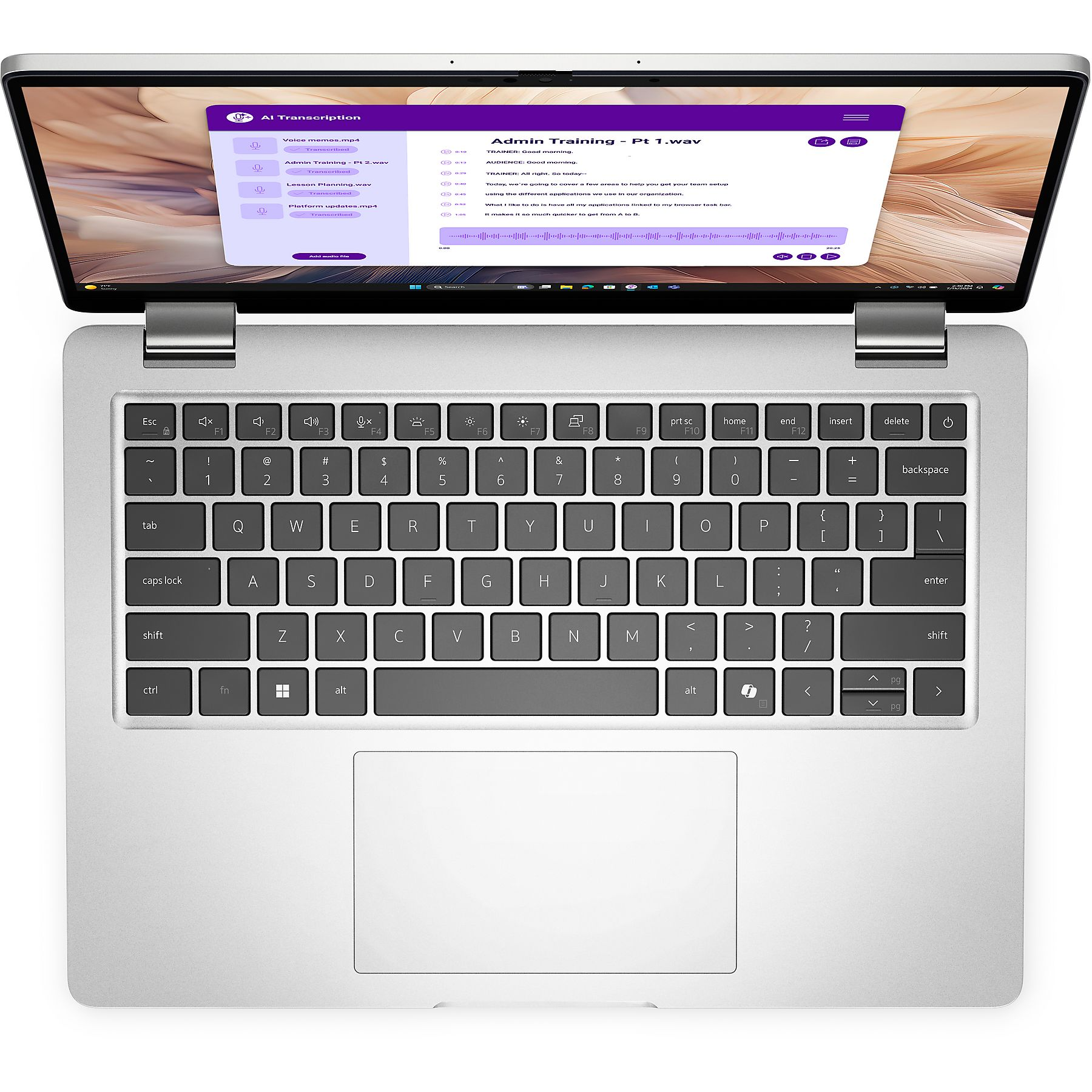 Un laptop aperto mostra un software di trascrizione IA con una forma d'onda.