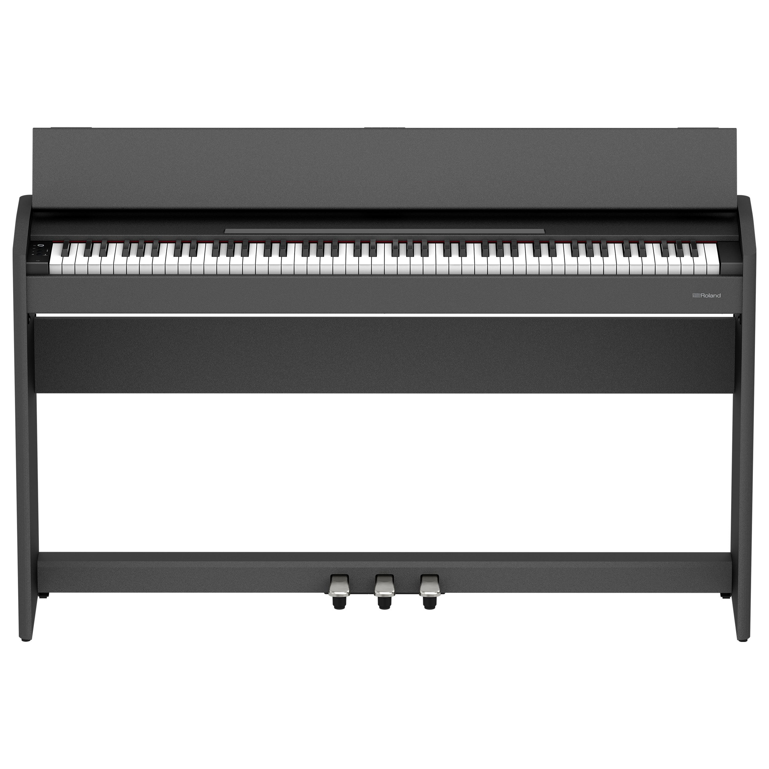 A dark digital piano with white and black keys and three pedals.