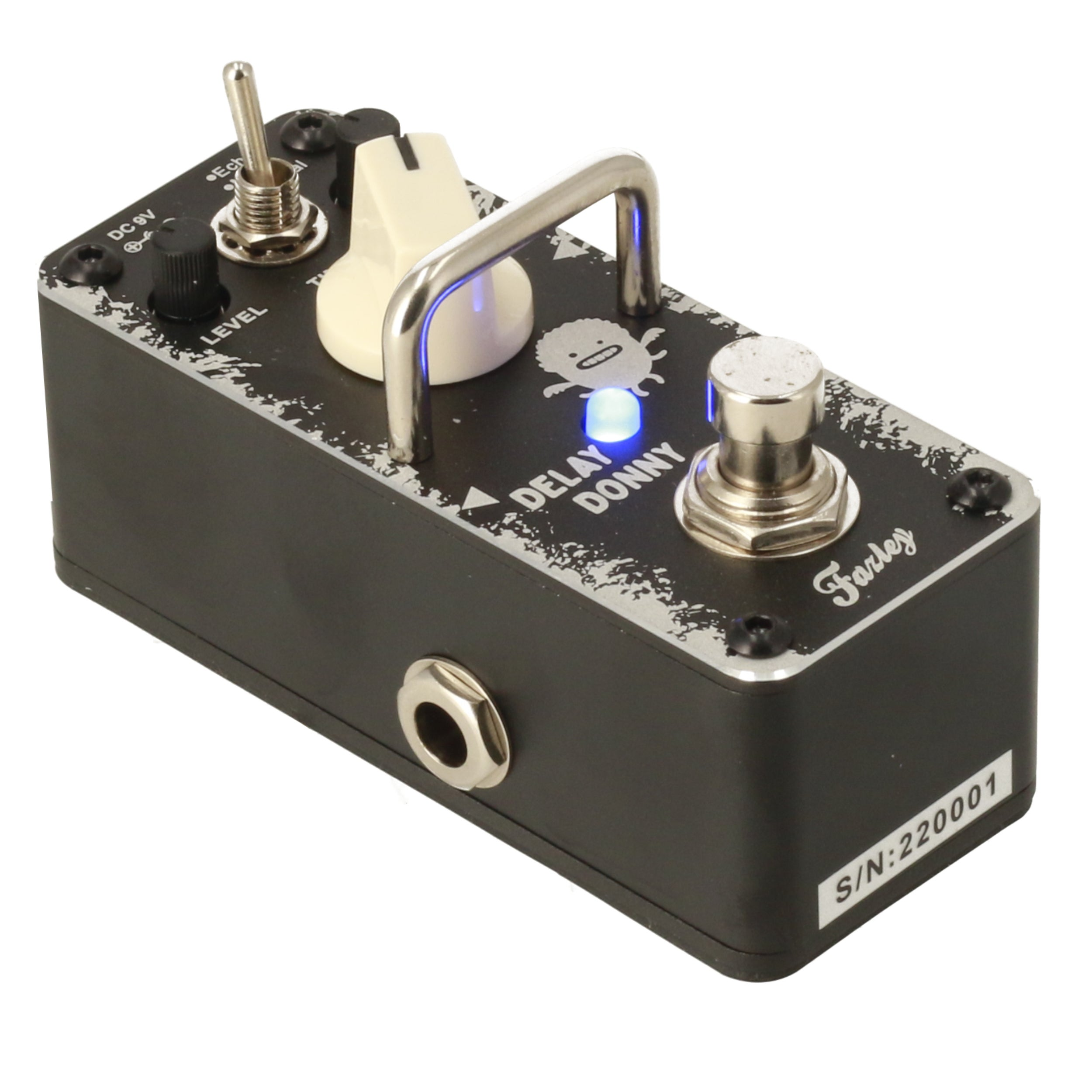 Black effect pedal with white cartoon, blue light, and silver knobs.