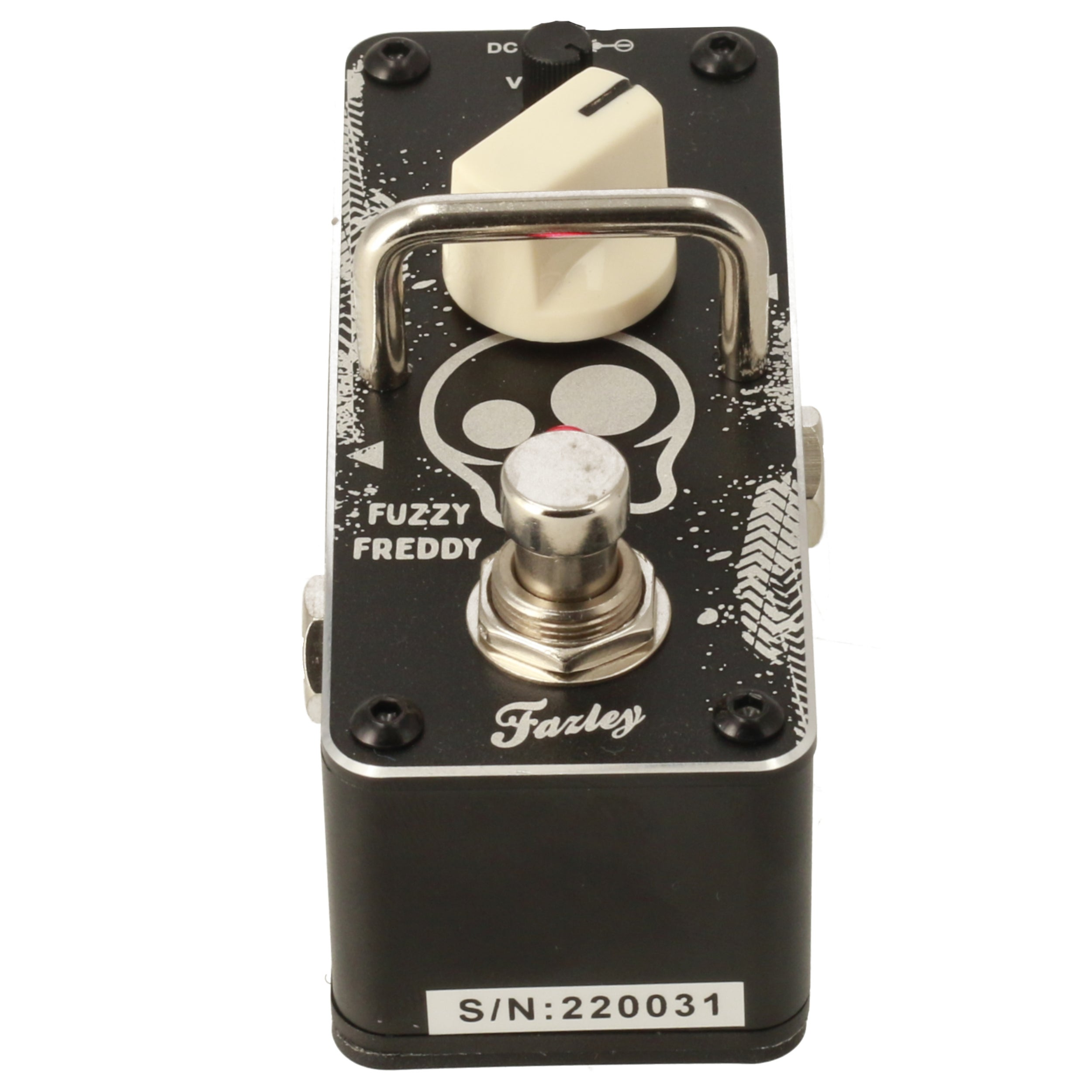 A black "Fuzzy Freddy" guitar effect pedal with a skull design and silver footswitch.