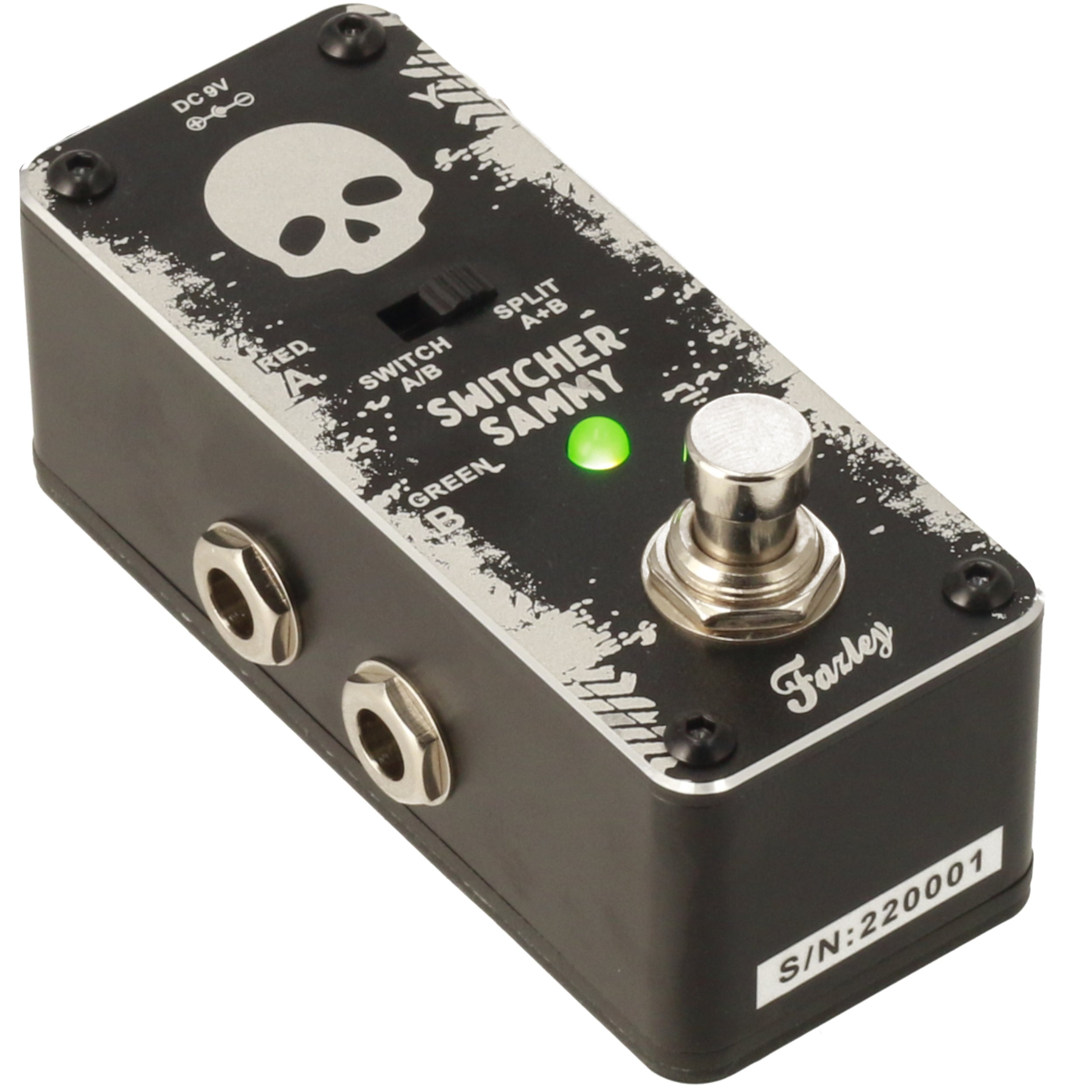 Black guitar pedal with skull logo and green LED indicator light.