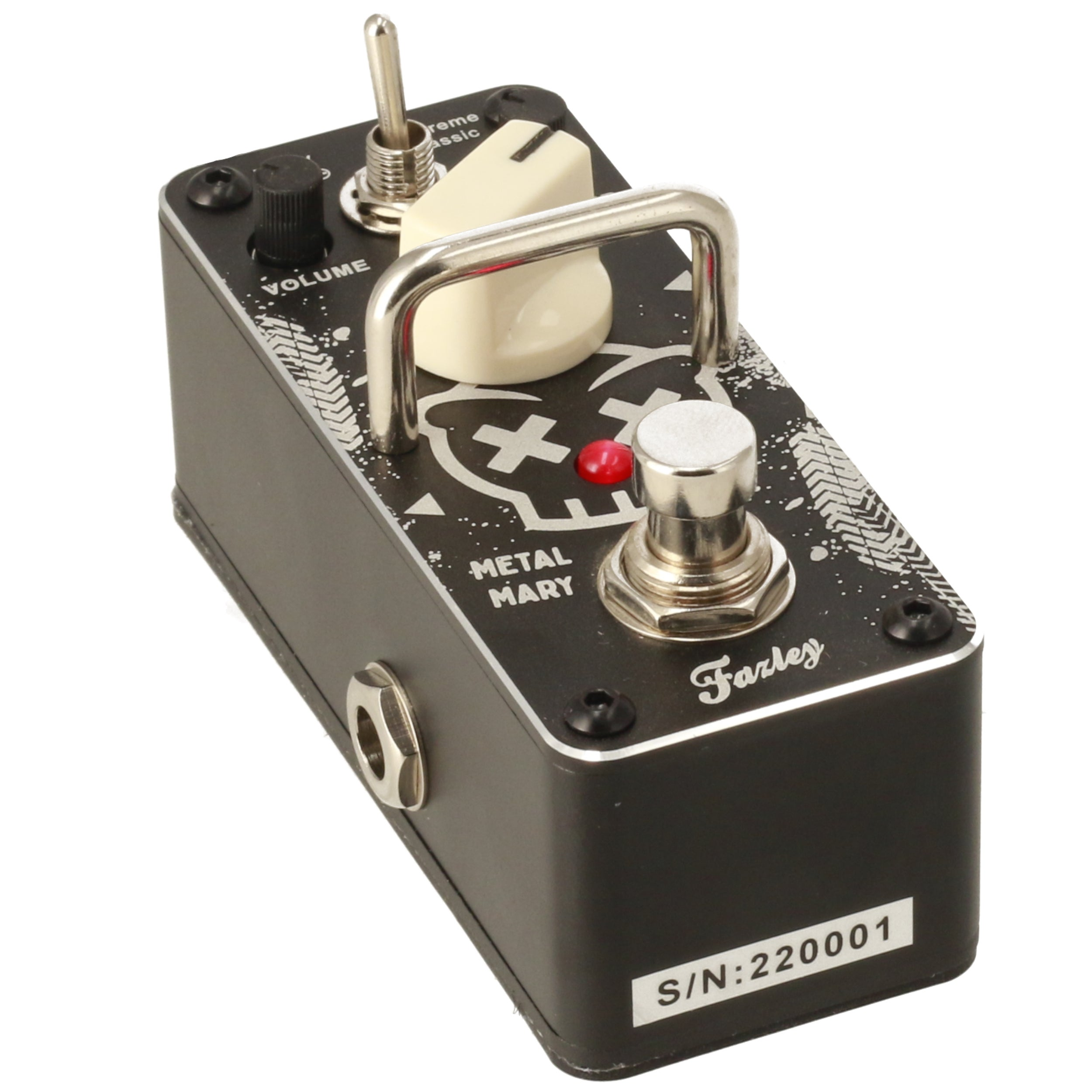 Black guitar effect pedal with skull design, silver knobs, and red LED indicator.