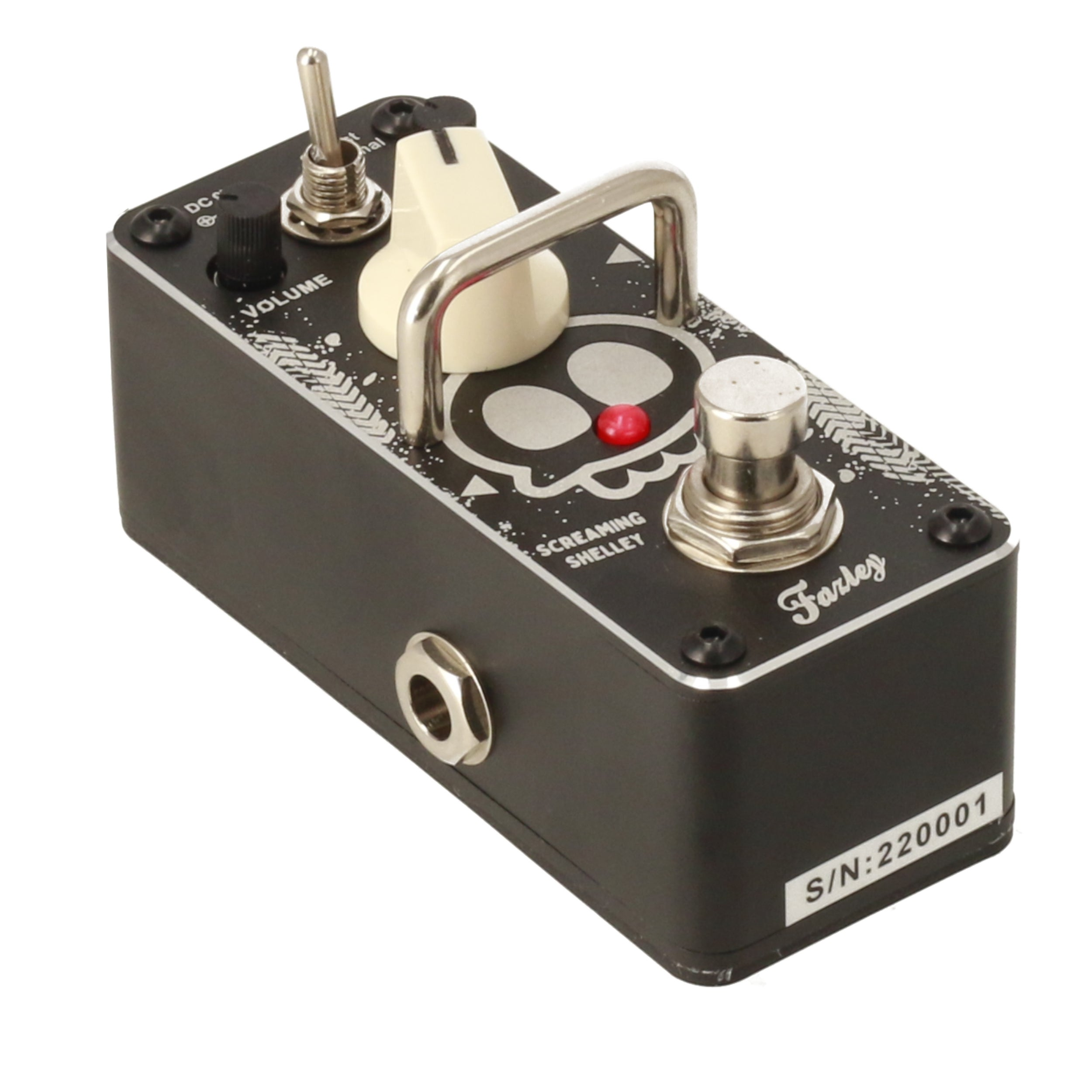 Black guitar effect pedal with skull design, silver toggle, and red LED indicator.