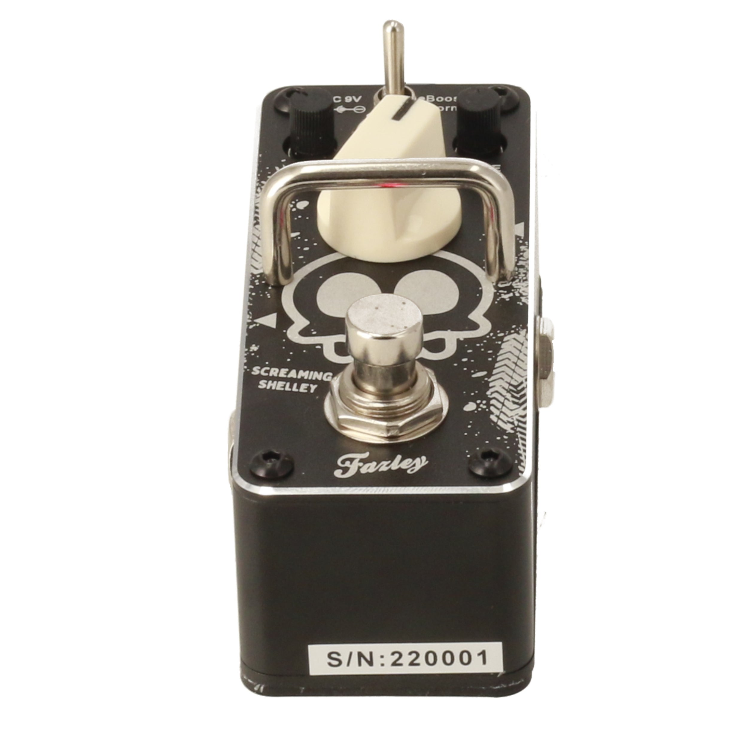 Black guitar pedal with skull design, knobs, switch, and serial number.