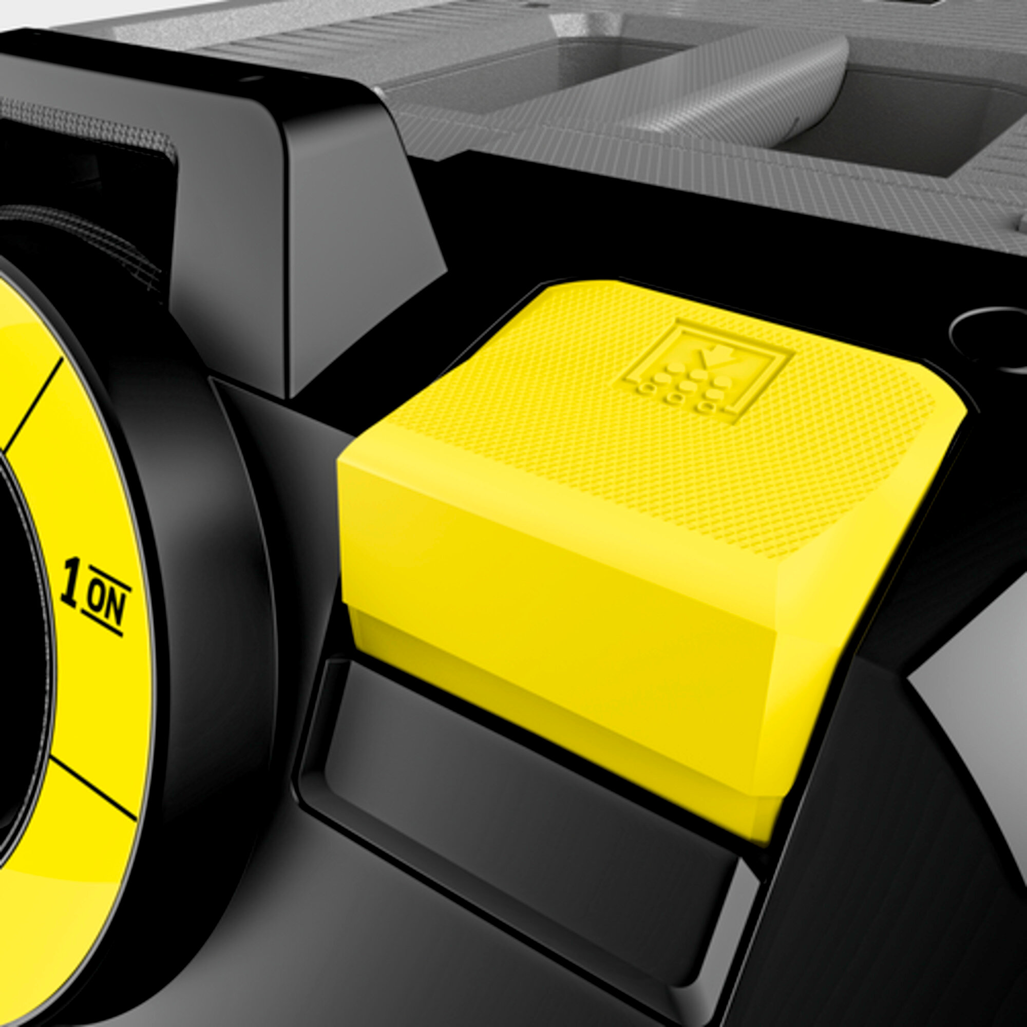 Żółty przycisk z symbolami i część żółtej tarczy z napisem 1 ON.