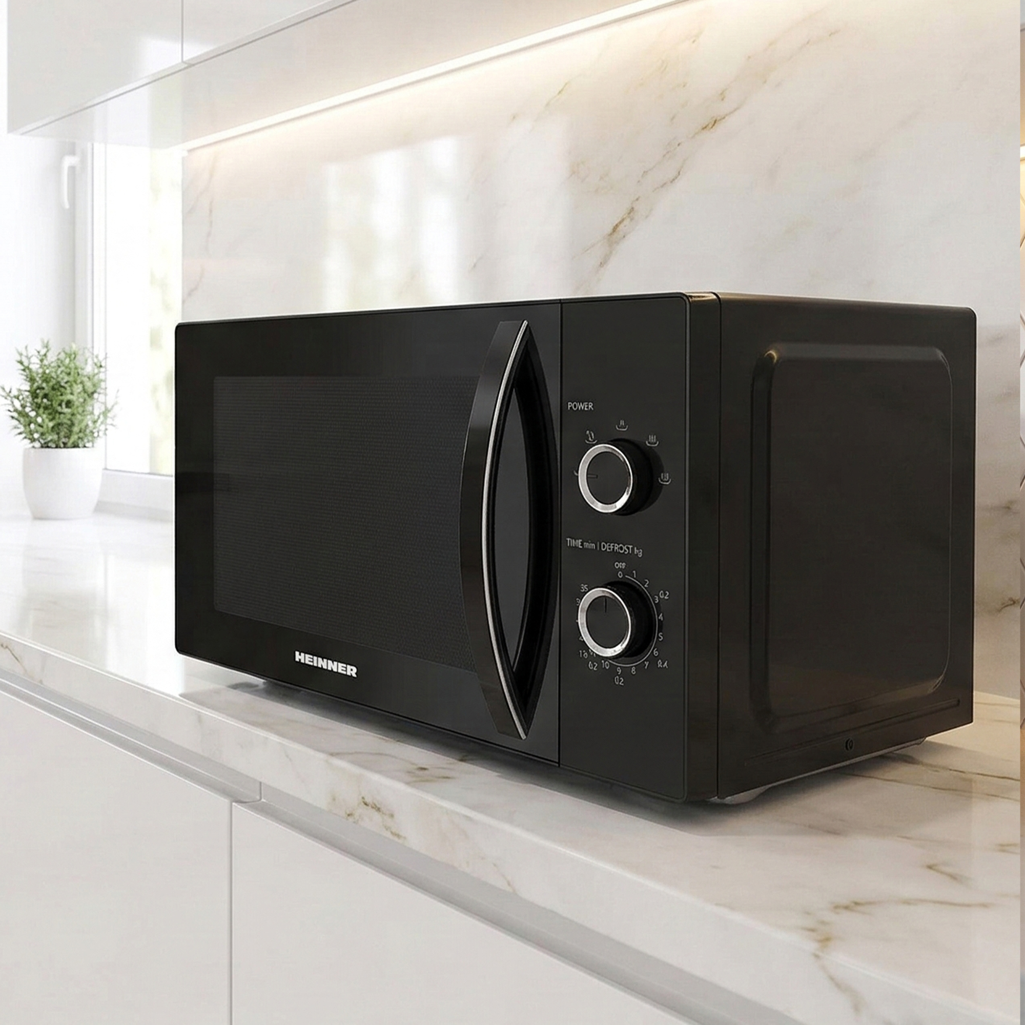 A black Heinner microwave with control knobs on a marble countertop.