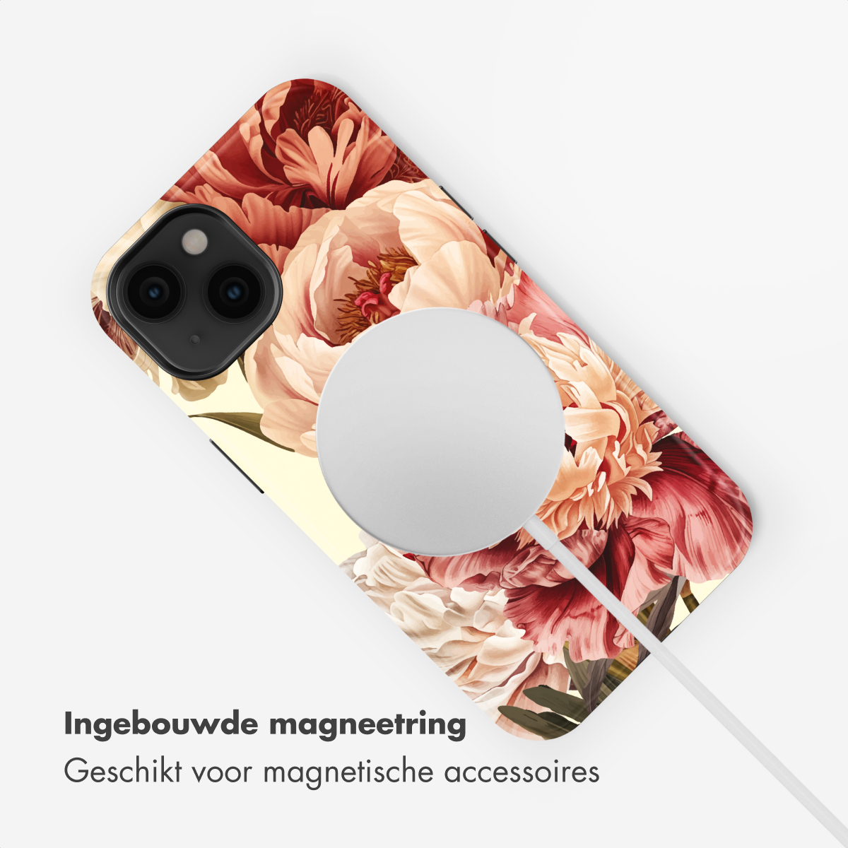 iPhone con fantasia floreale, con caricatore e cavo MagSafe.