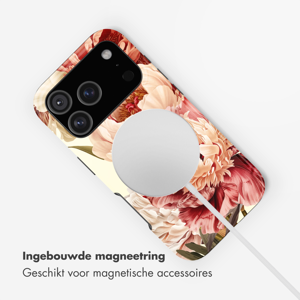 Una custodia per telefono con stampa floreale, anello MagSafe e cavo di ricarica.