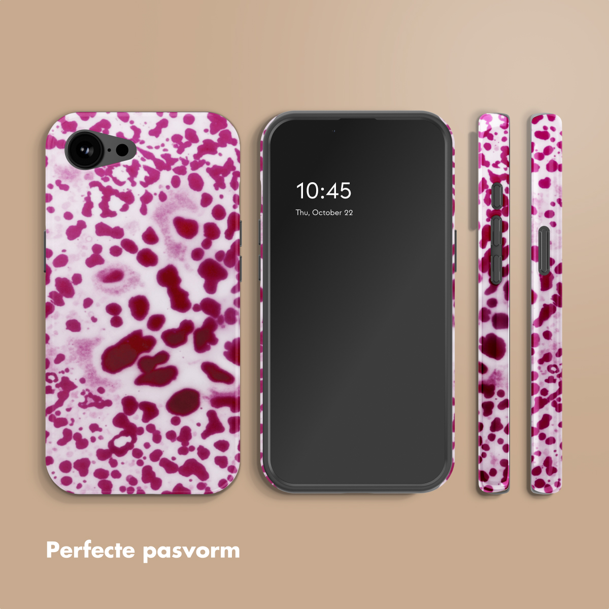 Un smartphone avec une coque ornée d'un motif de taches rouges sur fond blanc.