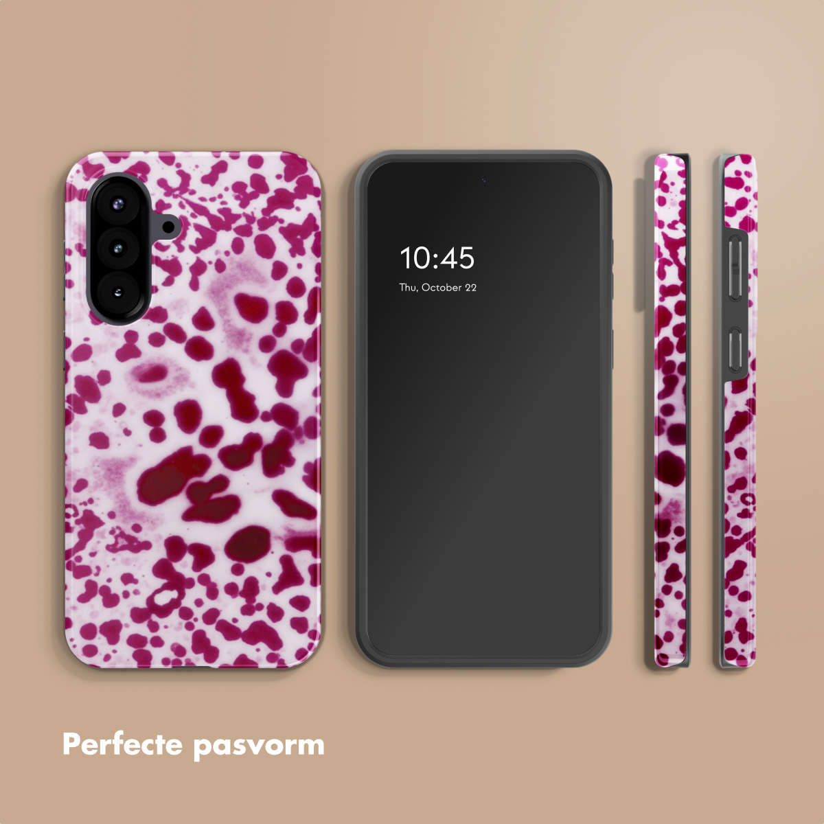 Een smartphone met een rood gespatte telefoonhoes ernaast.