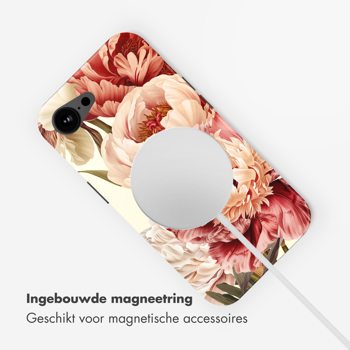 Una cover per telefono con motivo floreale di peonie collegata a un caricabatterie.