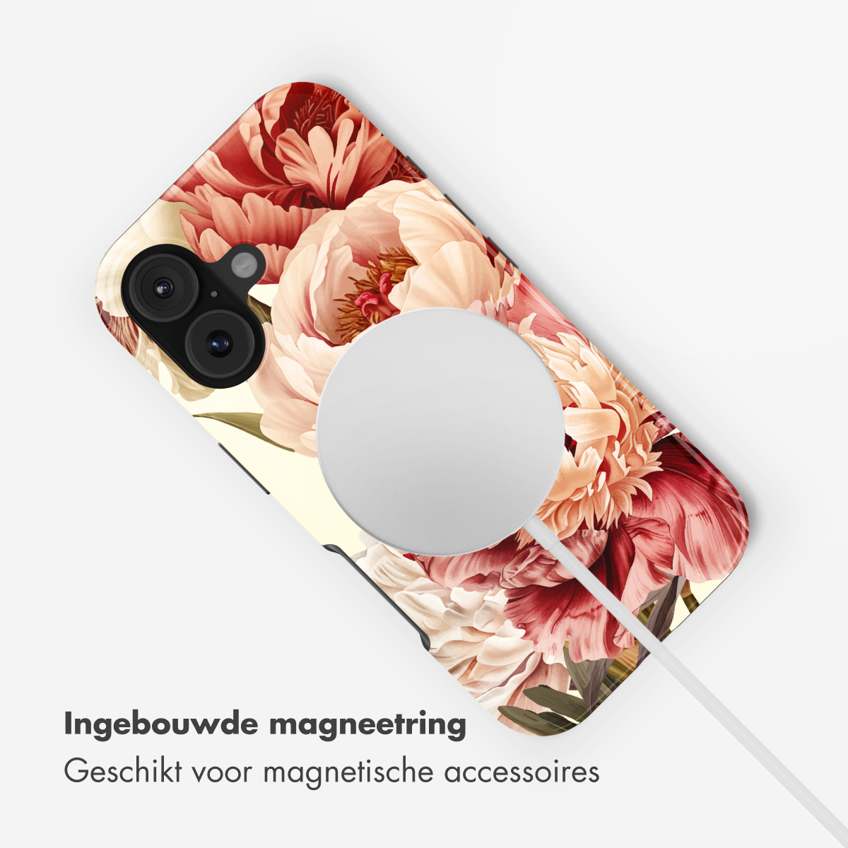 Una cover per telefono con fantasia floreale, in carica con cavo bianco.