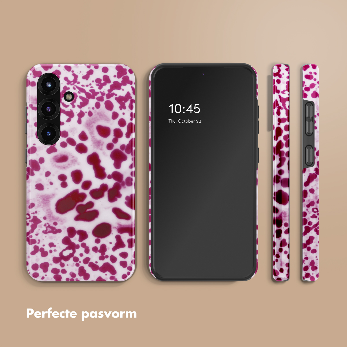Een telefoonhoesje met een rood-wit vlekkenpatroon naast een smartphone.
