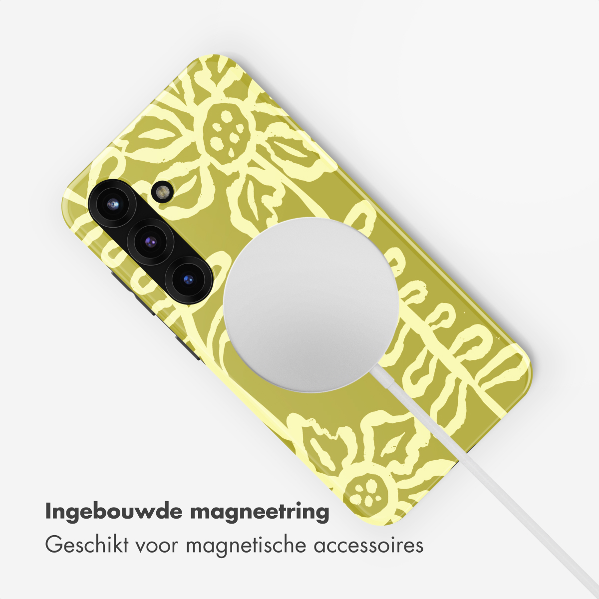 Telefoon met geel-groen bloemenpatroon, magnetische ring en oplaadkabel.