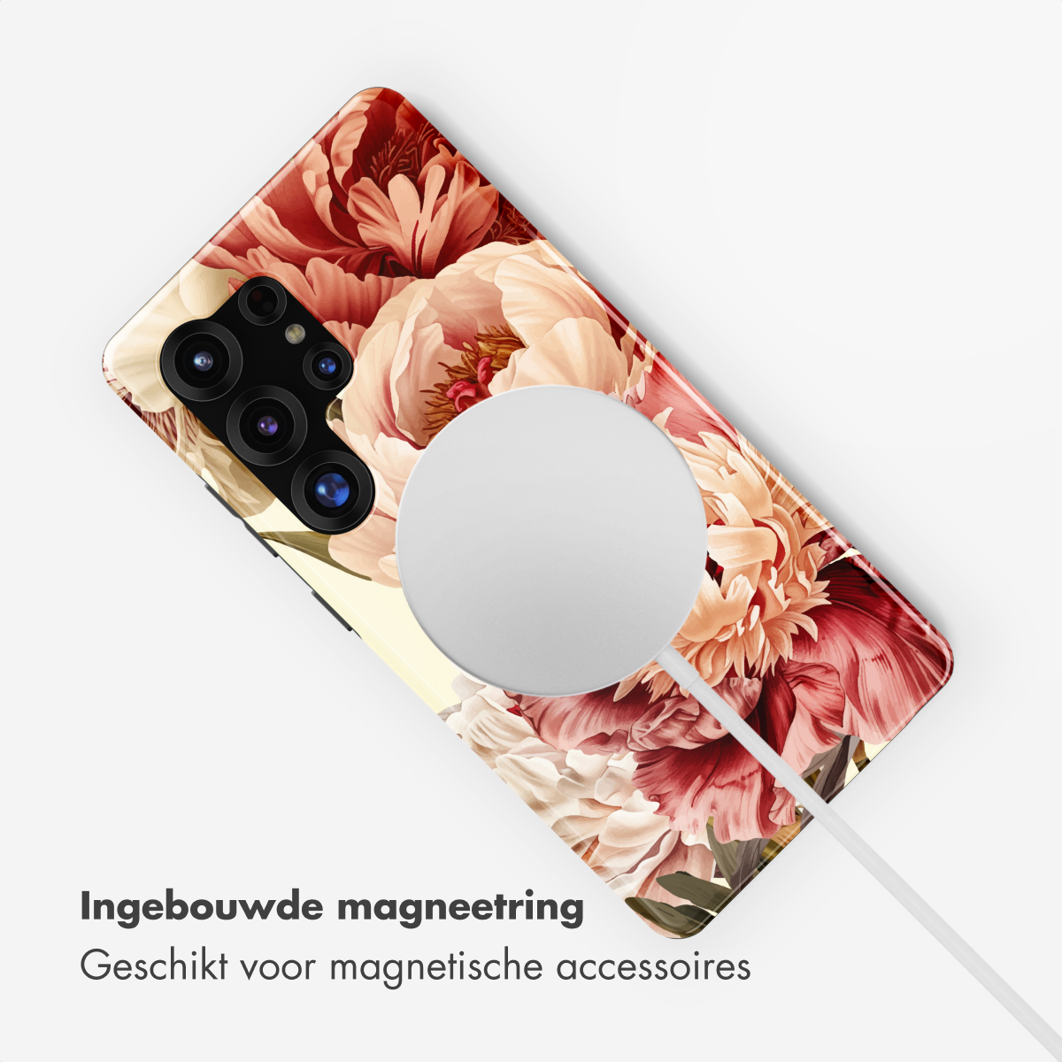 Achterkant smartphone met bloemenpatroon, magneetring en oplaadkabel.
