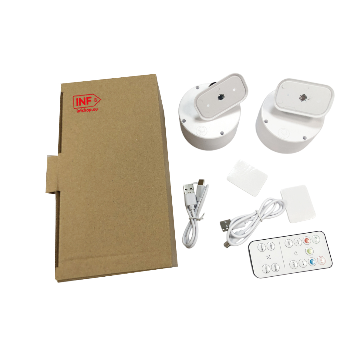Kartonowe pudełko, dwa białe obrotowe moduły, kable USB, pilot i podkładki samoprzylepne.