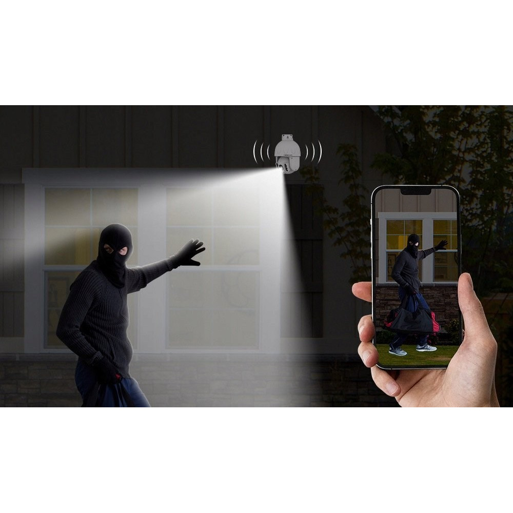 Włamywacz w czerni oświetlony przez kamerę monitoringu. Telefon pokazuje podgląd.