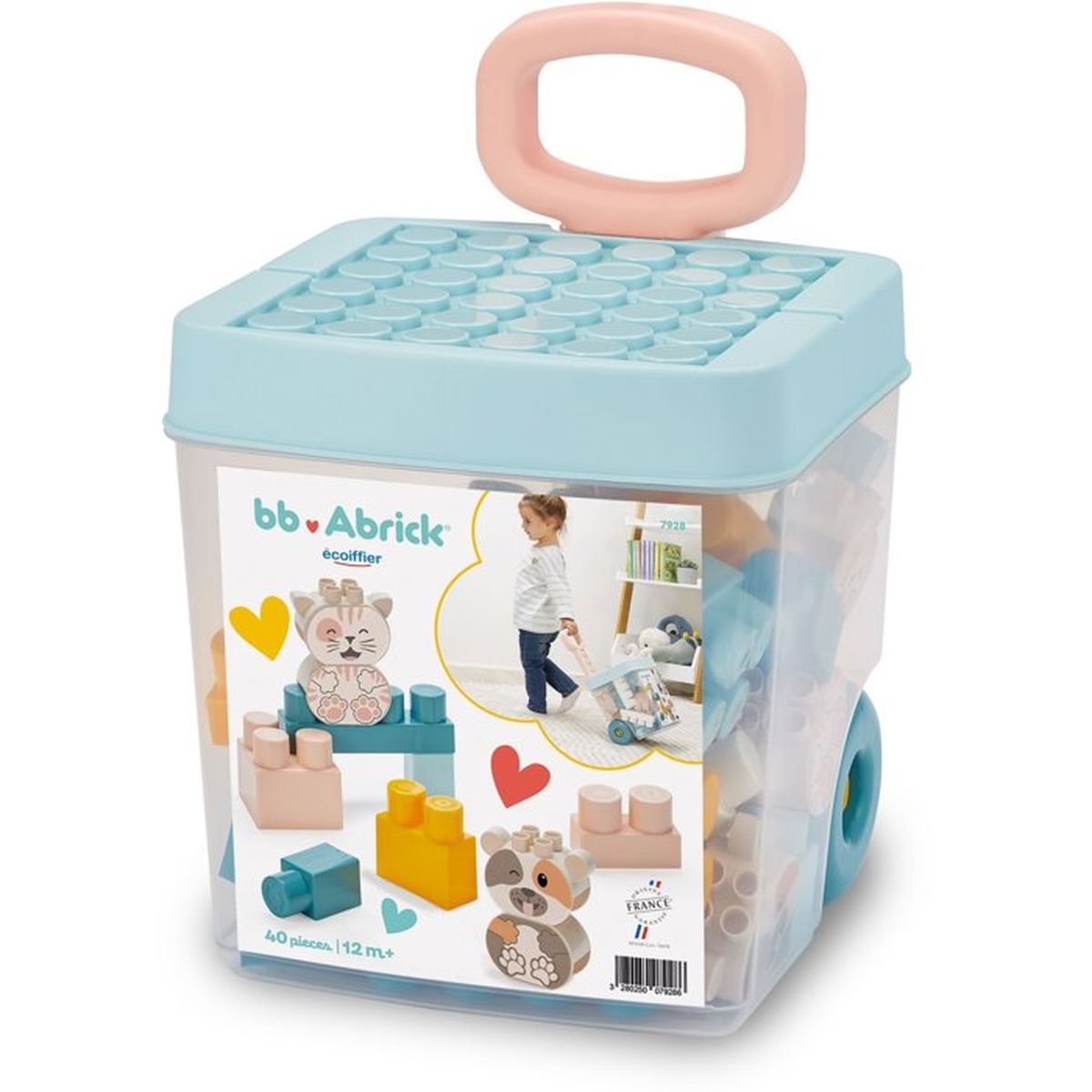 Contenitore blu con blocchi da costruzione, manico rosa e ruote. Presenta gatto e cane.