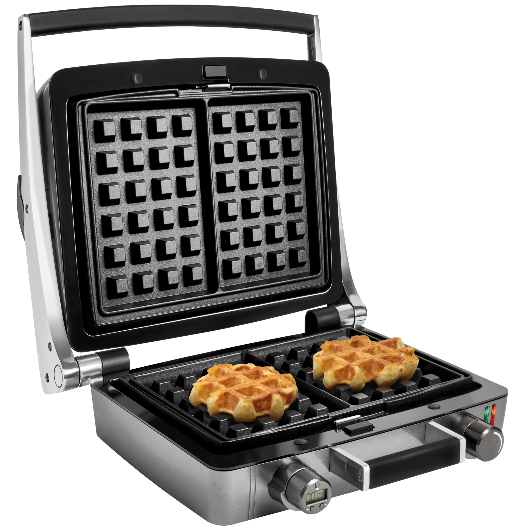 Una piastra per waffle aperta con due waffle pronti sulla piastra inferiore.