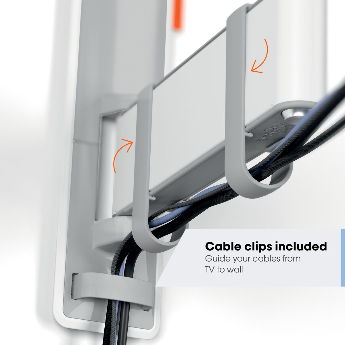 Szare klipsy na kable trzymają czarne i niebieskie kable na białej ścianie. Strzałki wskazują kierunek.