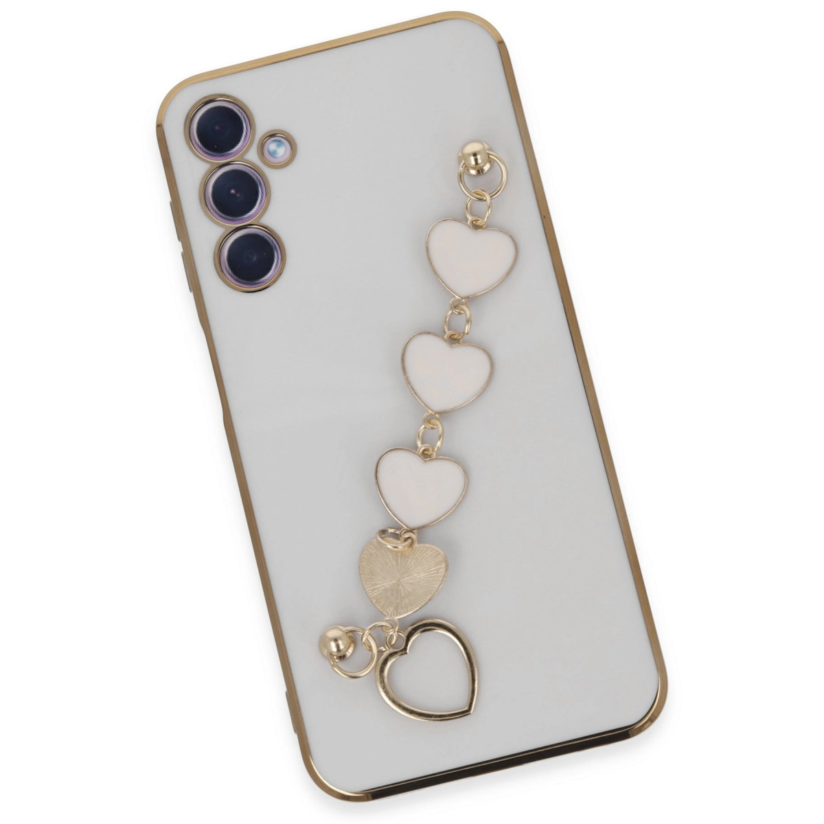Altın kenarlı beyaz telefon ve kalp şeklinde takılar zinciri.