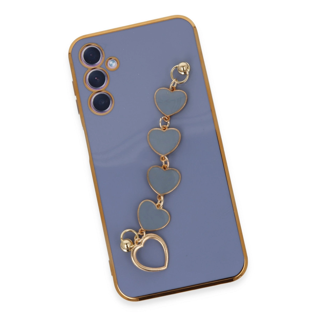 Altın süslemeli mor telefon kılıfı ve kalp şeklinde takı.