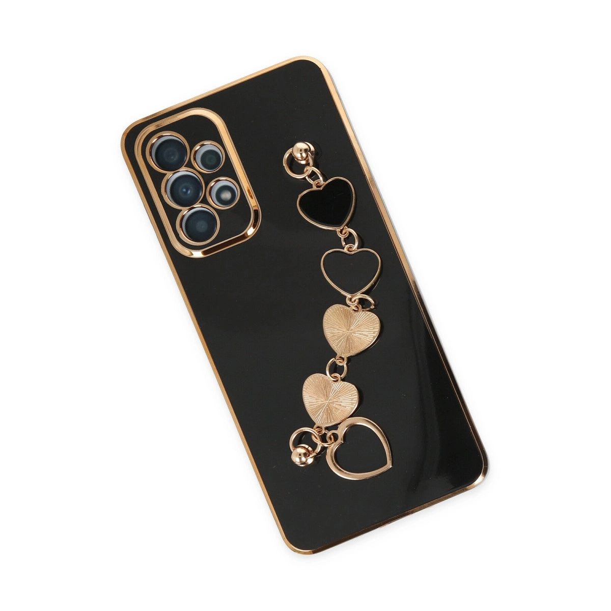 Altın süslemeli siyah telefon kılıfı ve kalp şeklinde charm.