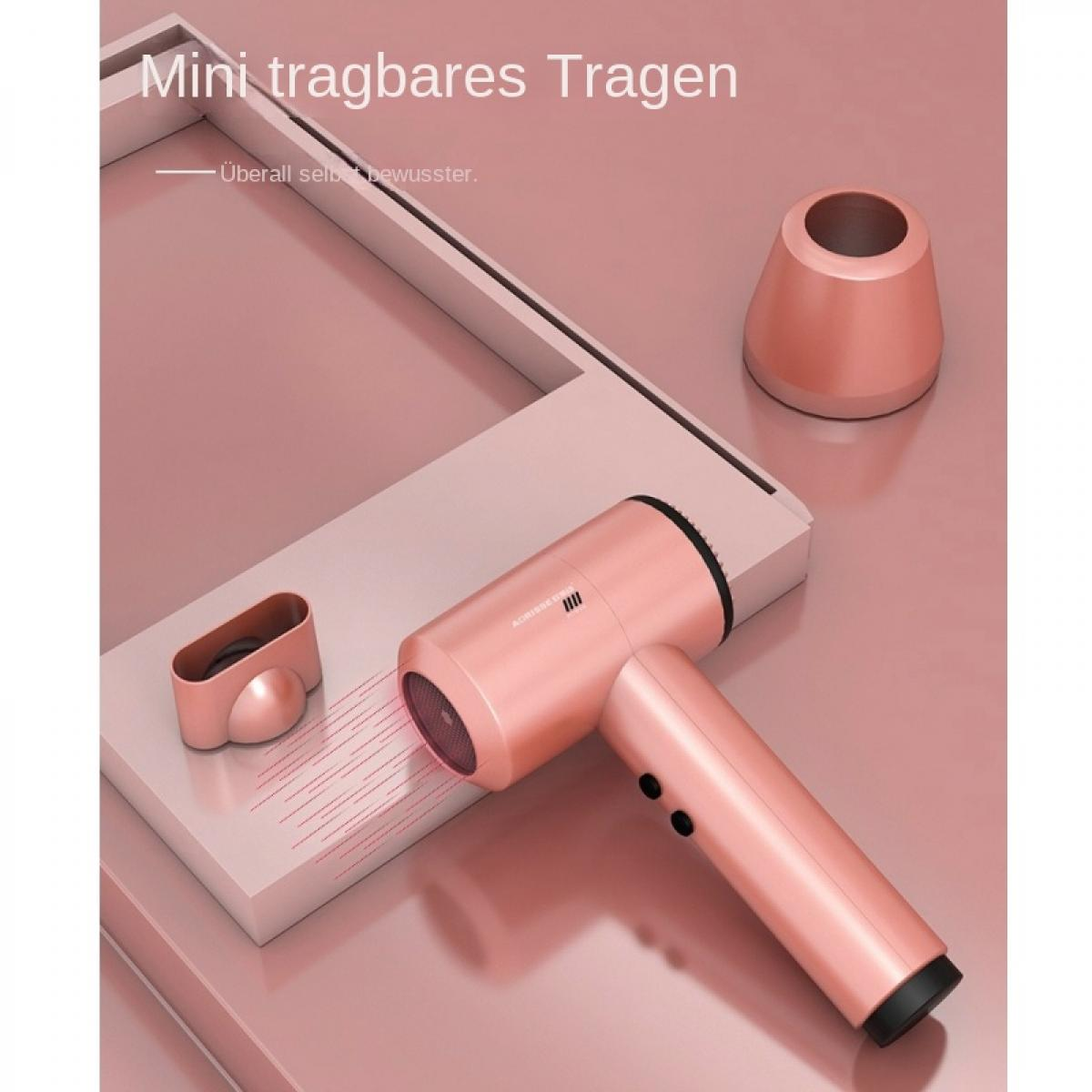 Ein roségoldener Mini-Haartrockner mit Zubehör auf einem rosafarbenen Display.