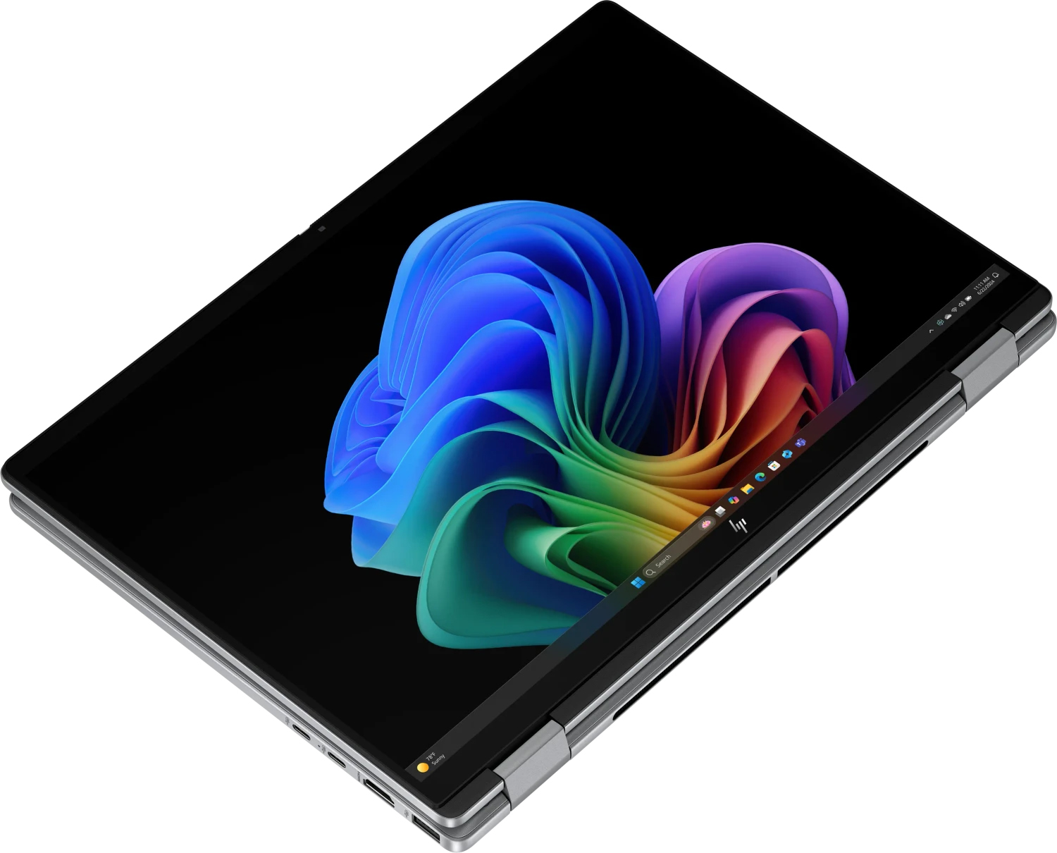 Otwarty laptop wyświetlający kolorowy, falisty wzór na ekranie.