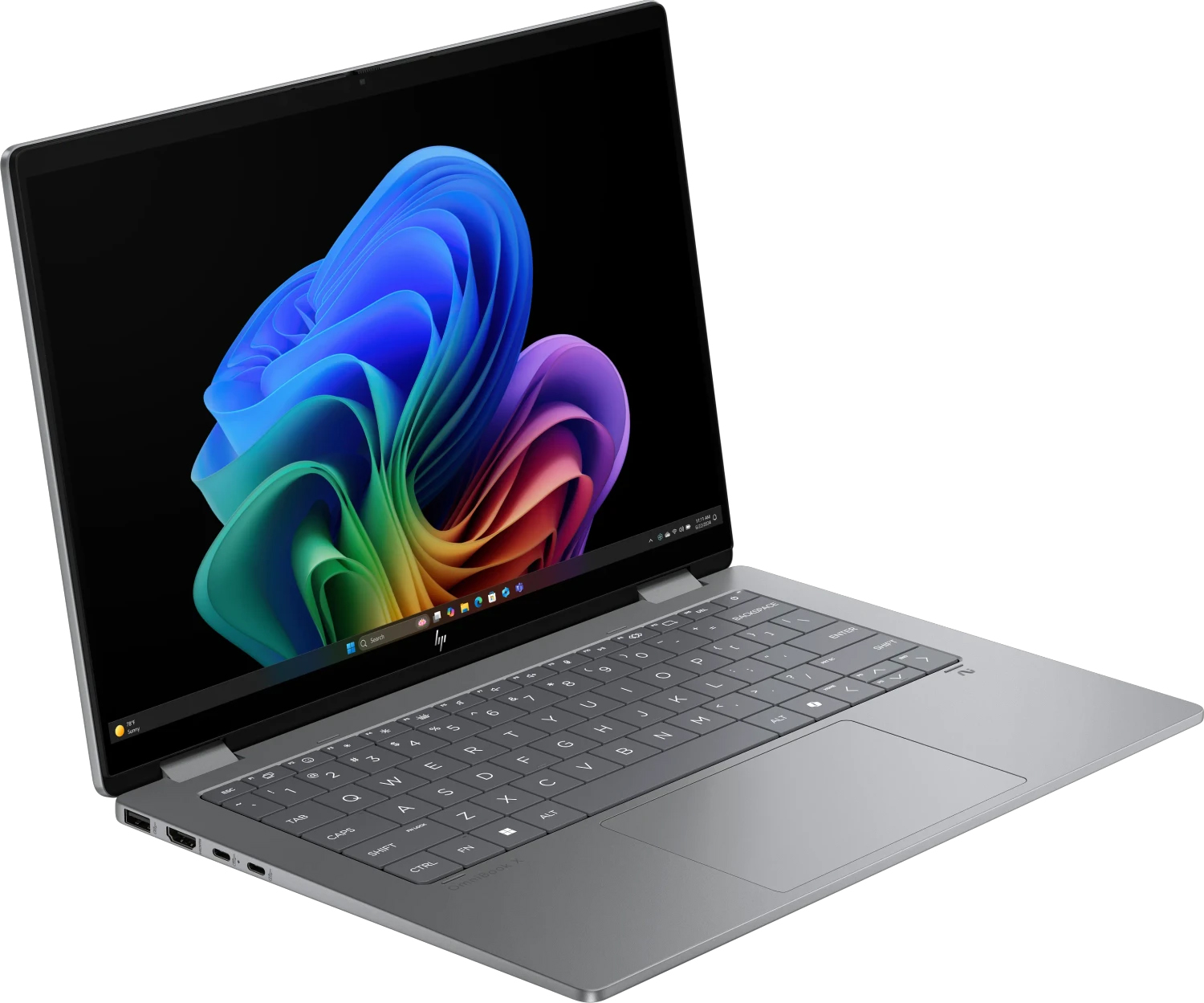 Srebrny laptop HP z żywعادة, abstrakcyjną tapetą na ekranie.