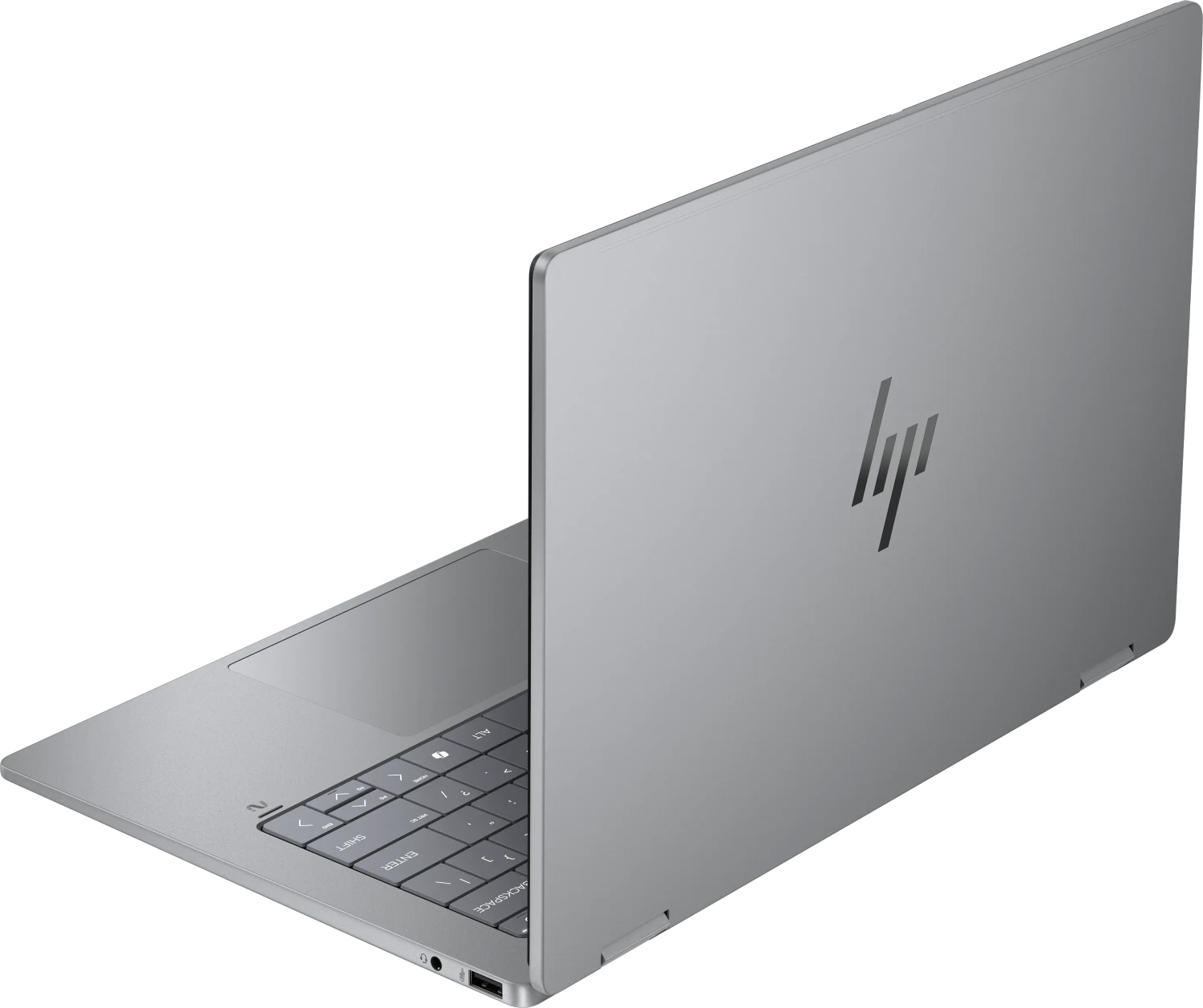 Srebrny laptop HP, częściowo otwarty, widoczna klawiatura i logo HP.