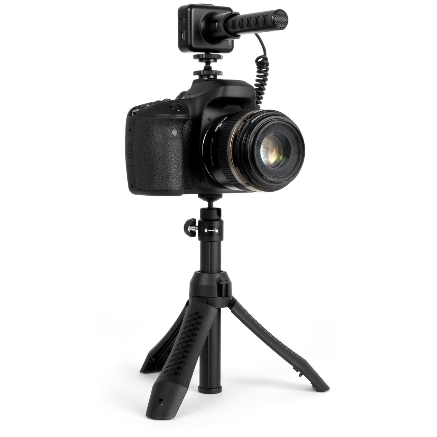 Una fotocamera digitale nera con microfono su un piccolo treppiede.