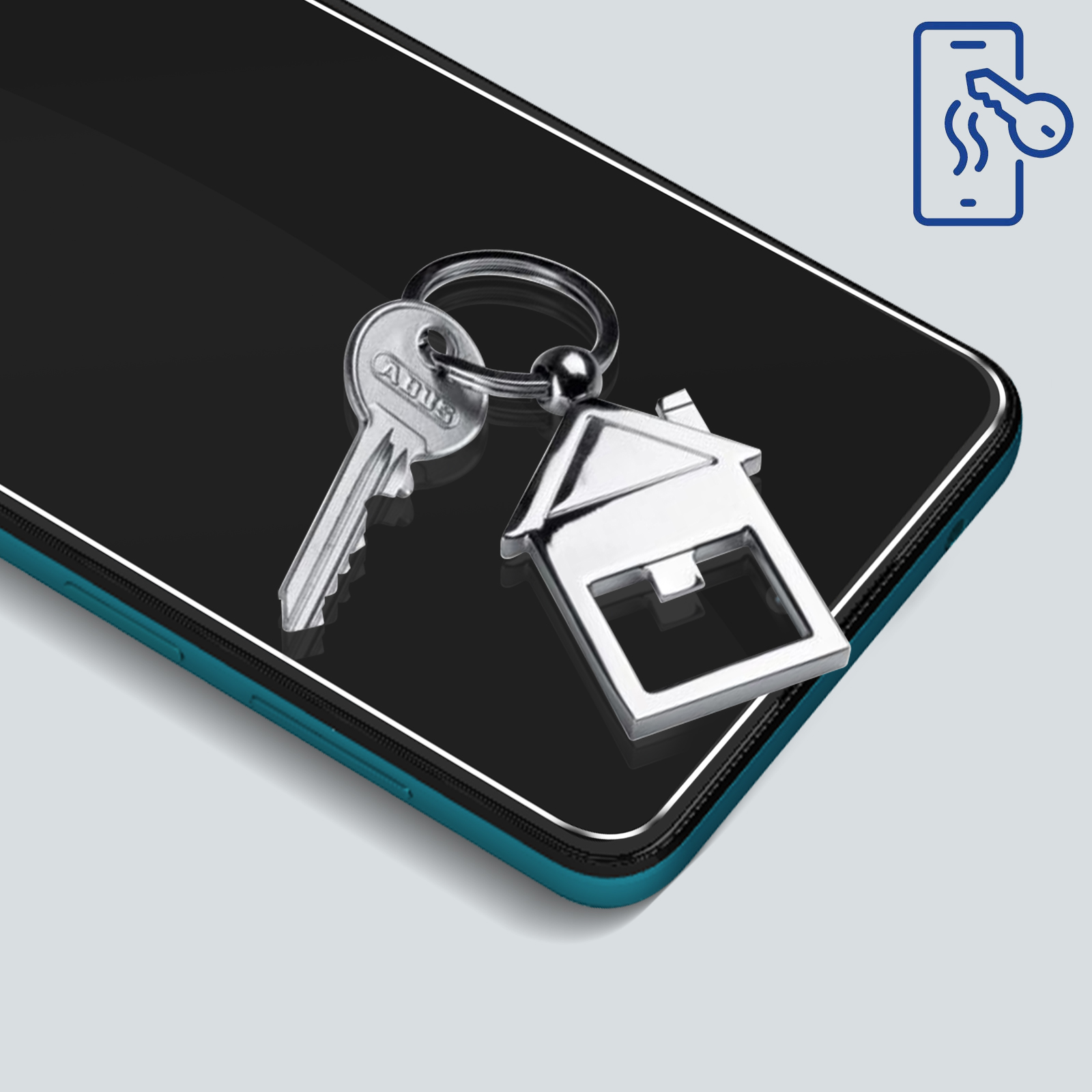 Un portachiavi con un ciondolo a forma di casa poggia sullo schermo di uno smartphone.
