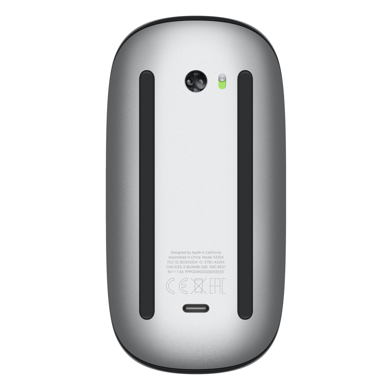 Spód srebrnej myszy Apple Magic Mouse z portem ładowania i etykietami.