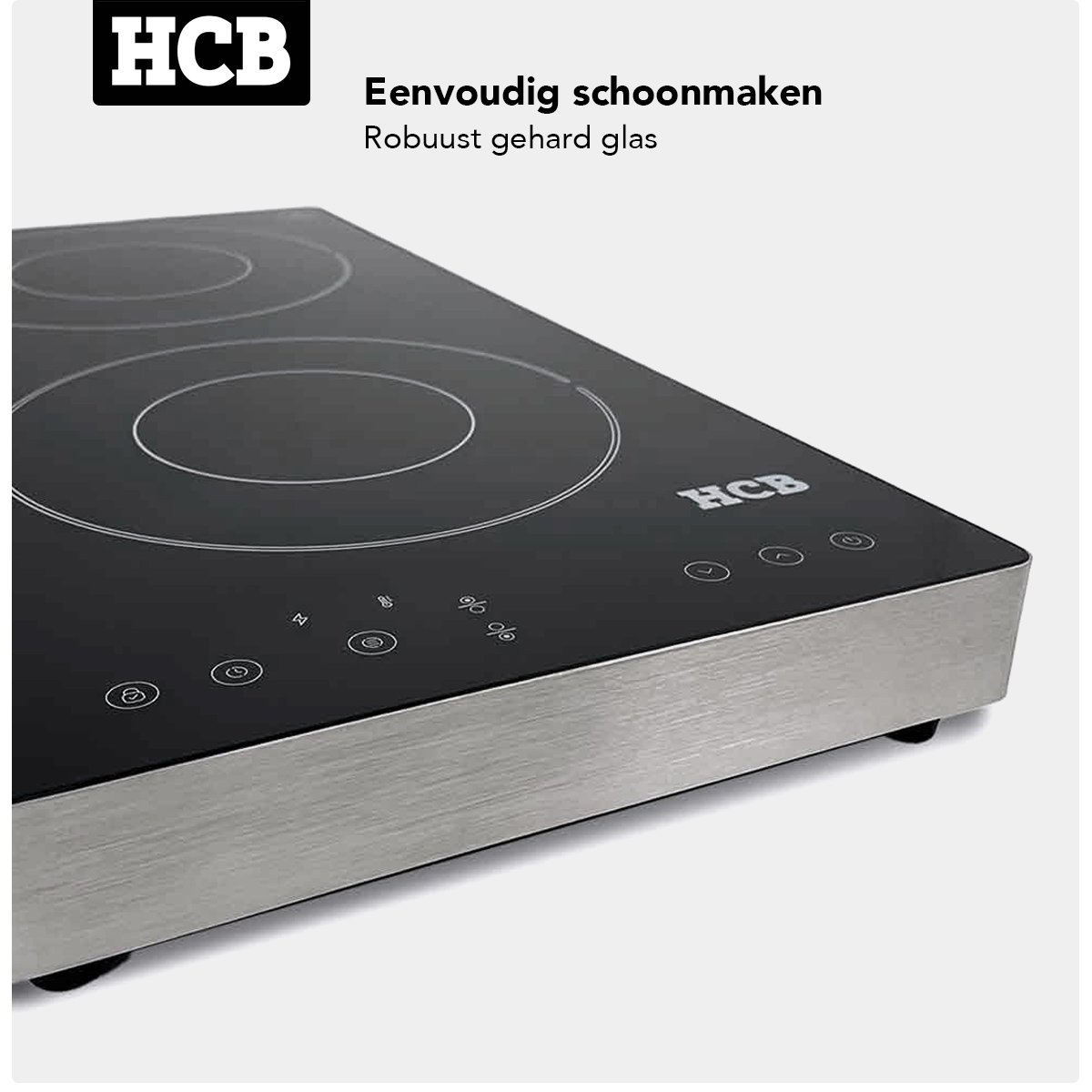 Zwart inductie kookplaat met zilveren rand, HCB-logo en touch-bediening.