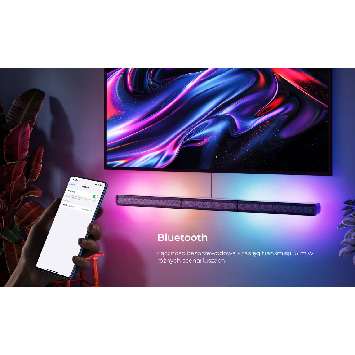 Telefon pokazuje ustawienia Bluetooth obok telewizora i soundbara z oświetleniem.