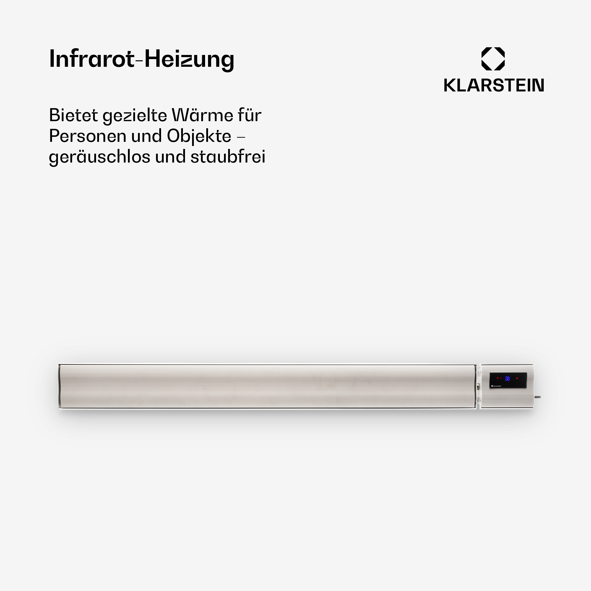 Eine schlanke, silberne Infrarotheizung mit digitaler Anzeige, montiert an einer weißen Wand.