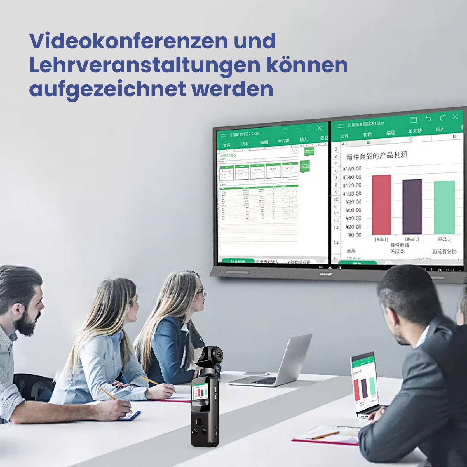 Menschen in einem Besprechungsraum, die auf einen großen Bildschirm schauen.