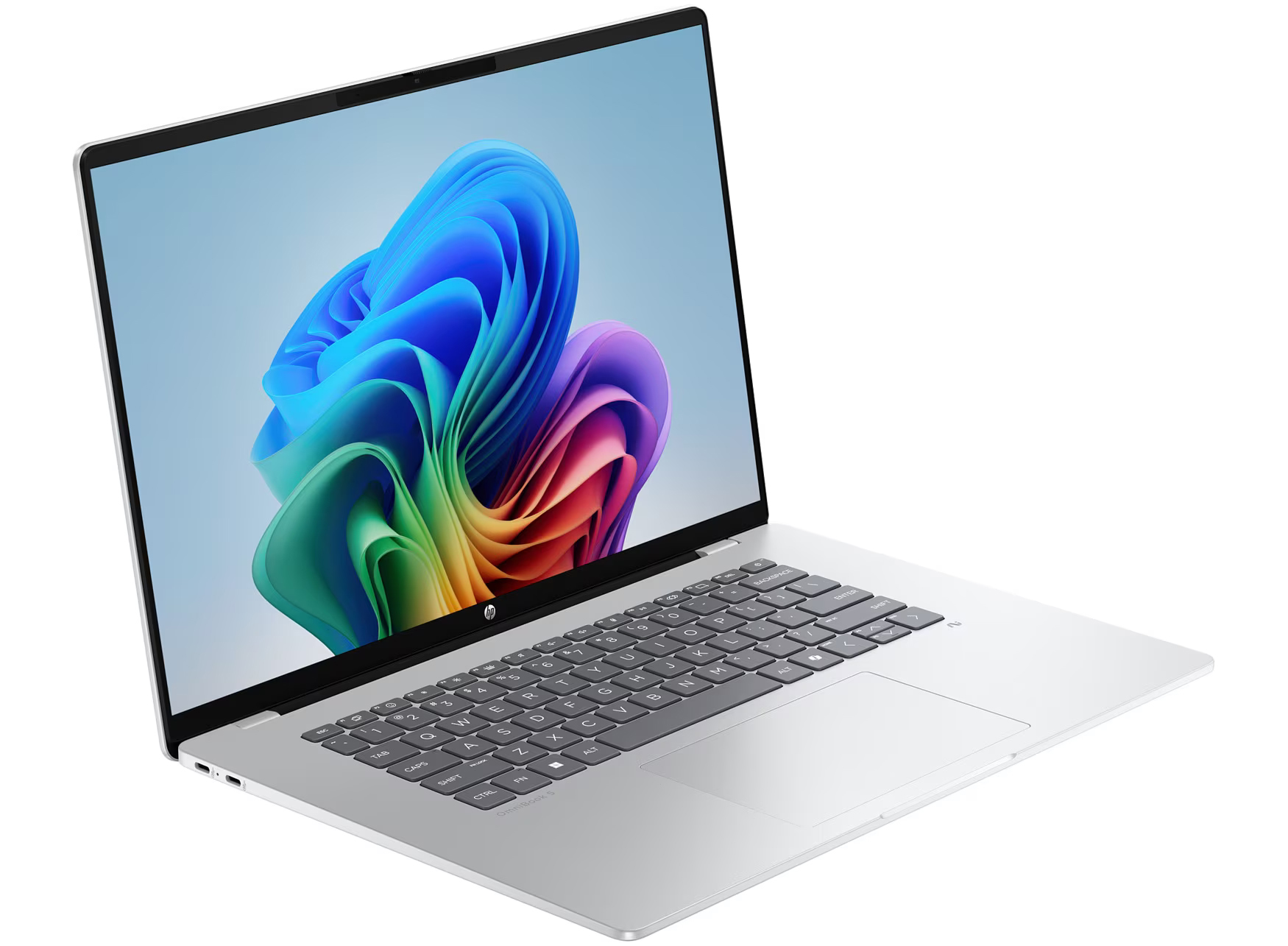 Srebrny laptop z kolorową, abstrakcyjną tapetą na ekranie.